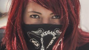 A defiant woman in a bandana.