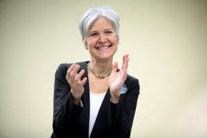 Politician Jill Stein, smiling and clapping.