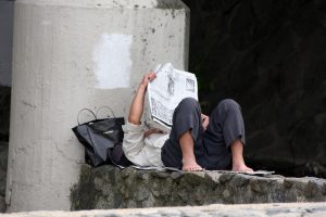 A man reading a newspaper.