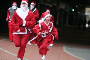 Entrants in a charity fun run dressed as Santa