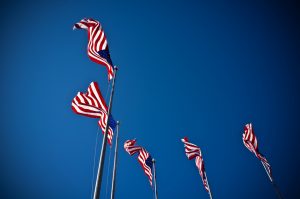 US Flags waving on a sunny day.