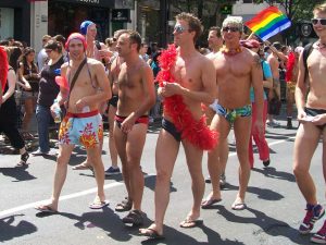 A group of white men playing at Pride
