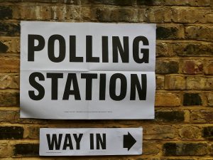 A sign indicating the way to a polling station