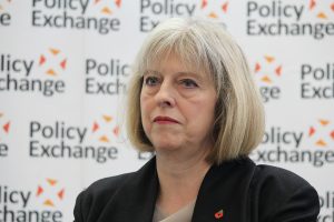 Theresa May, a white woman with greying hair, looking exasperated.