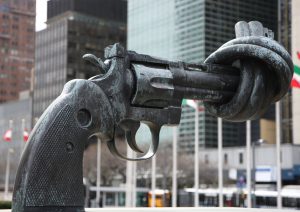 A statue of a gun, barrel tied in a knot