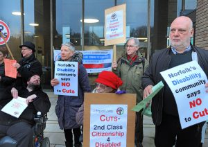 Protesters expressing concern about cuts to disability services