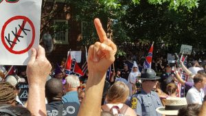 Counterdemonstrators flipping off KKK members in Charlottesville