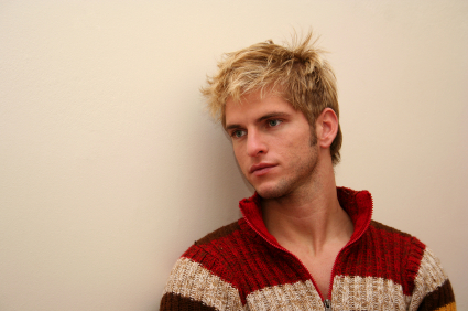 young man infront of wall