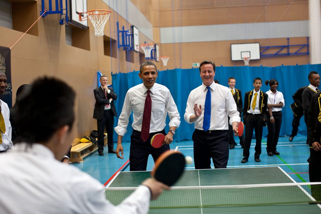 President Barack Obama and British Prime Minister David Cameron in a game of ping-pong.