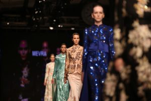 Women in flowing, tailored Muslim garments.