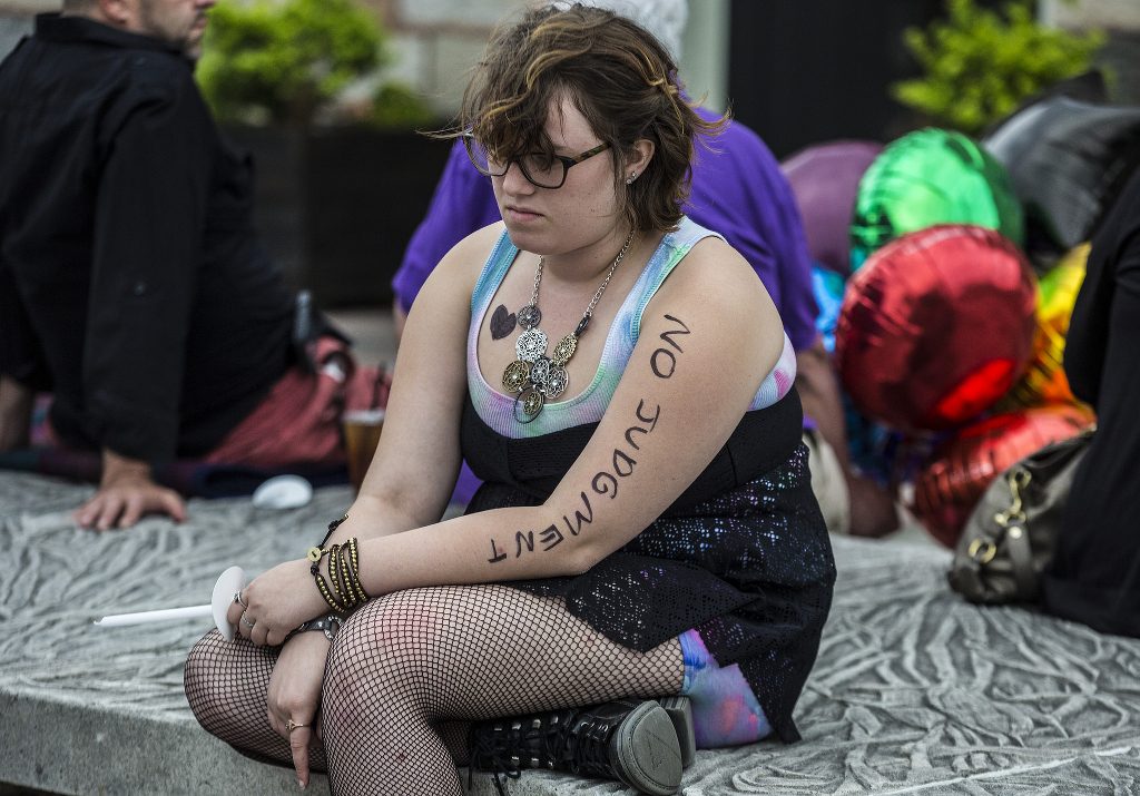 A person attending a vigil for victims of the Orlando shooting