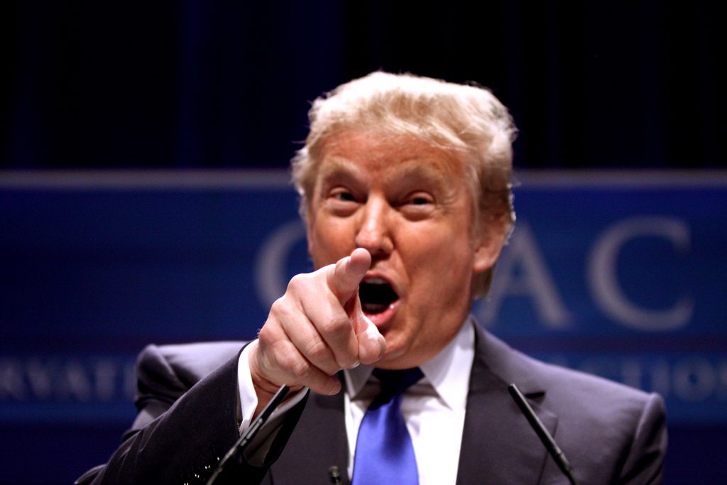 Donald Trump shouting at an event.