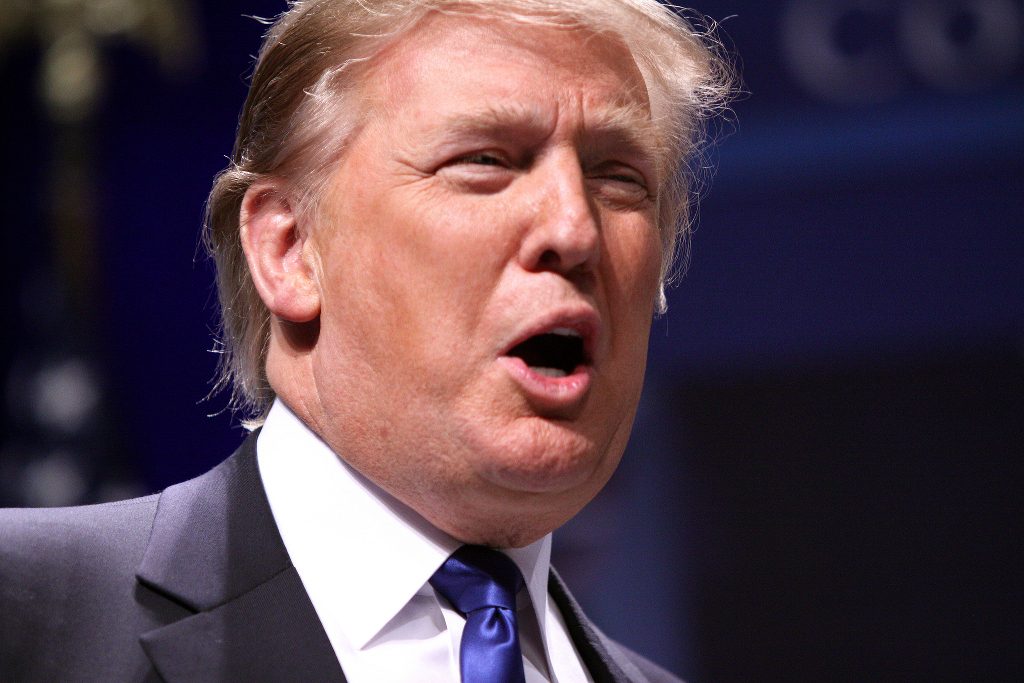 Donald Trump screaming at an event.