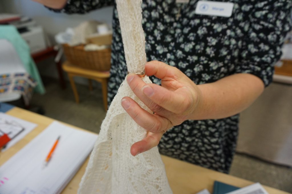 Pulling Lace Through a Wedding Ring in Haapsalu