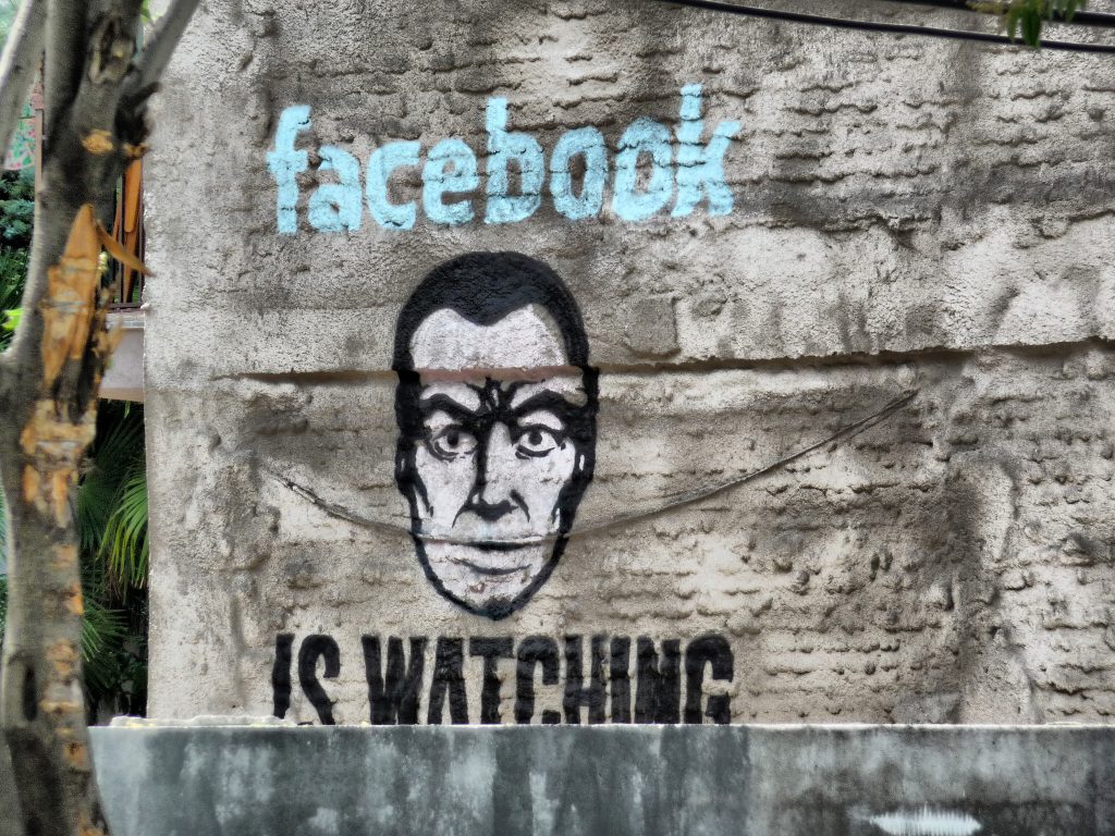 A political mural: FACEBOOK IS WATCHING