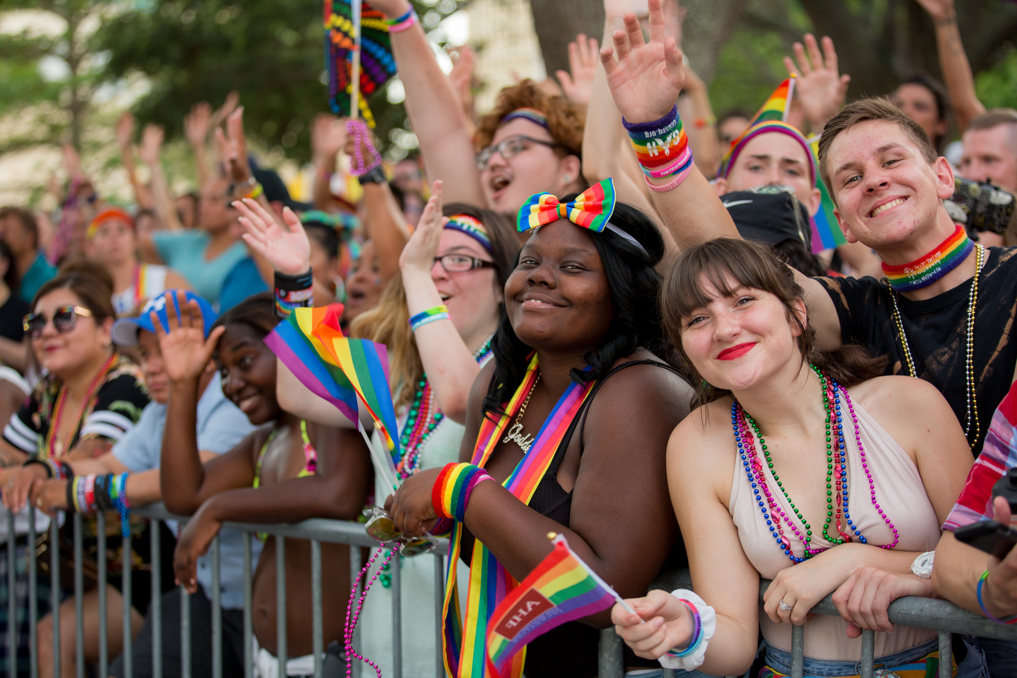 People on the sidelines of a pride parade