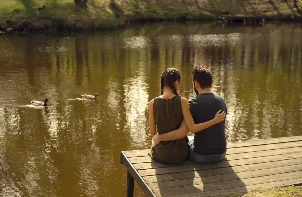 Two people on a dock