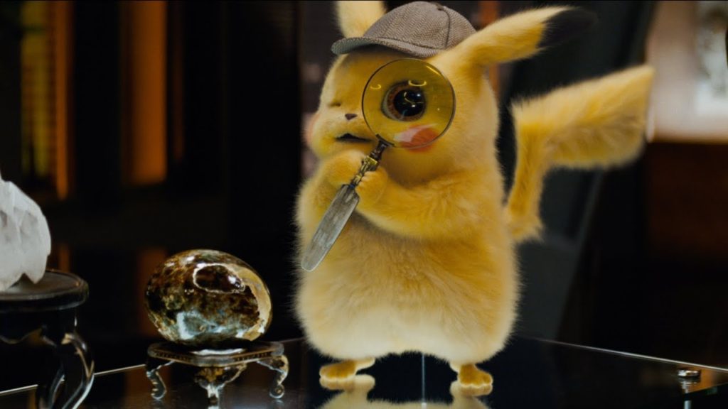 a film still showing pikachu dressed as a detective