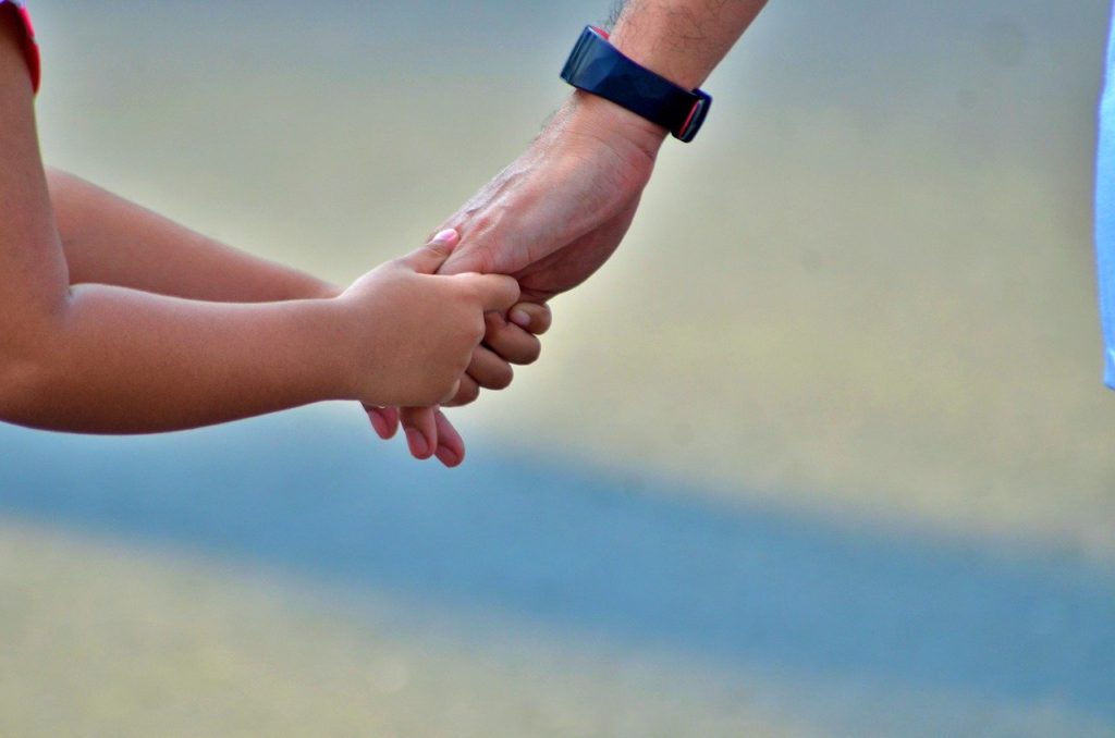 Child holding hands