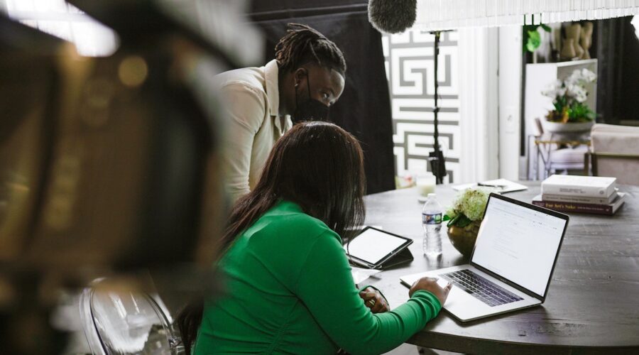 Working Man and Woman in Office with a Laptop